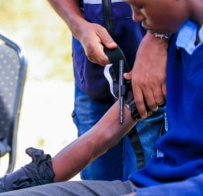 Tourniquet application Trainee applying a tourniquet to a casualty's arm