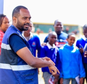 School outreach QuickFix instructor speaking with students at a school outreach